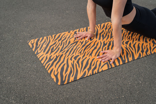 stand out with a tiger print orange yoga mat